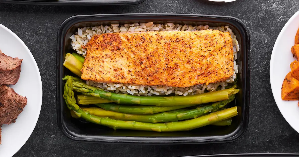 Perfectly grilled salmon with rice and asparagus served on a plate for a healthy, flavorful meal