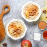 Close-up of creamy Apple Cinnamon Oatmeal with diced apples and cinnamon sprinkled on top