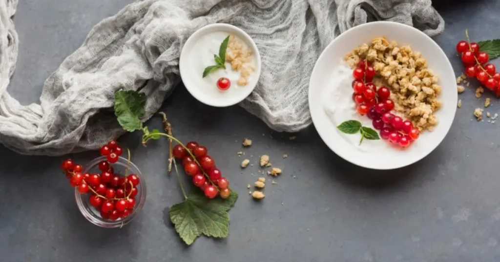 A spoonful of plain Greek yogurt with a smooth, thick texture