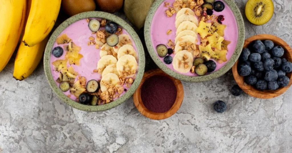 A delicious Smoothie Bowl with Banana and Almond Butter, garnished with fresh fruits and crunchy granola